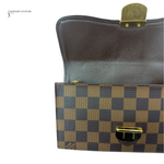 Two pouches, one with a gold clasp and checkered pattern, on a white background.