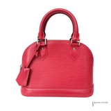 Red handbag with a strap on a white background