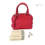 Red handbag with a cleaning cloth, keys, and lock on a white background