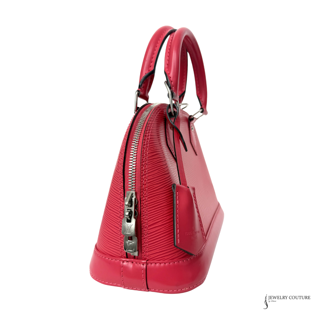 Red handbag with a visible brand logo on a white background