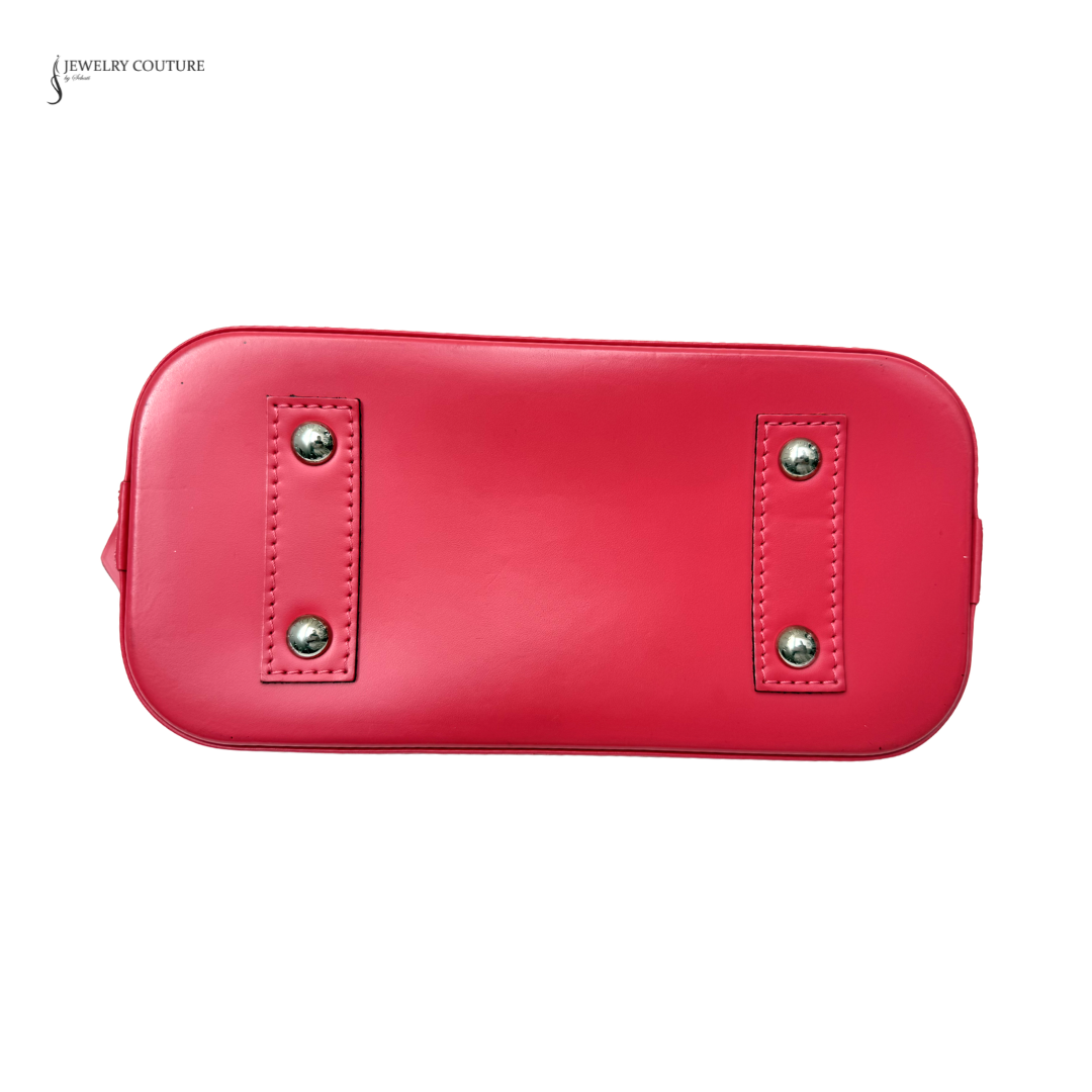 Red handbag with silver studs on a white background