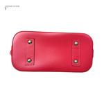 Red handbag with silver studs on a white background