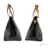 Two black handbags with brown handles on a white background
