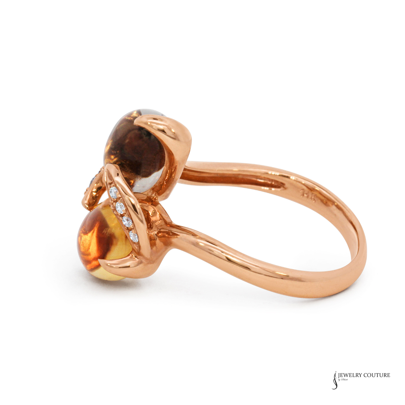 Rose gold ring with gemstones on a white background