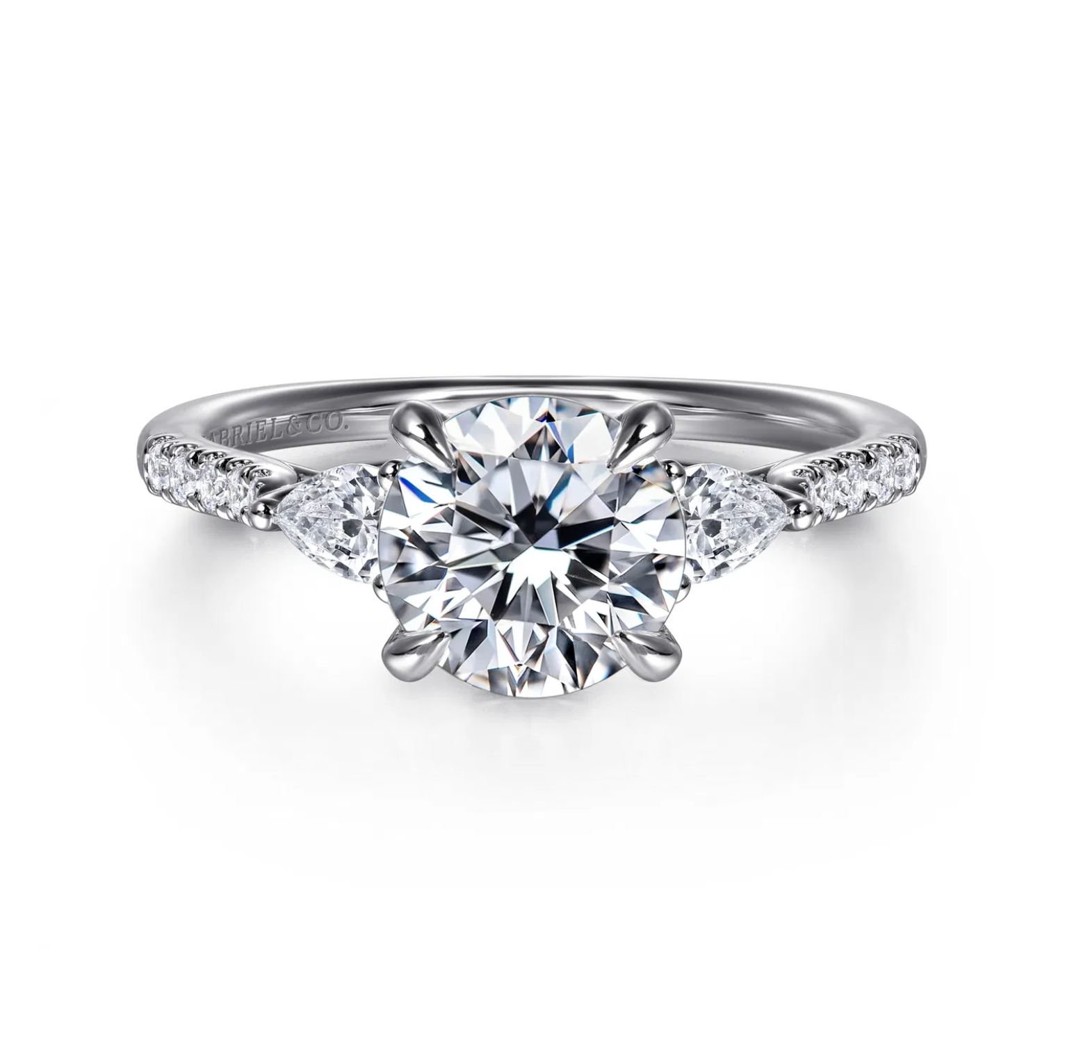 Gabriel & Co. Monty three stone engagement ring in 14K white gold, round center with pear side stones and pavé band, front view