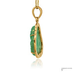 Jade Buddha pendant side profile showing carved jade depth, gold claw prongs and bail