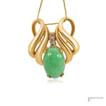 Estate 14K yellow gold jadeite and diamond pendant, oval green jade cabochon with three round diamonds, front view