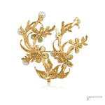 Back of estate 14K gold jadeite and pearl floral brooch showing pin closure