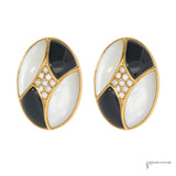 Pair of estate 14K yellow gold oval earrings with mother-of-pearl, black onyx and diamond centers, front view