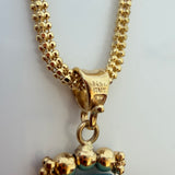 14KT Italy stamp on the bail of the estate turquoise tassel pendant