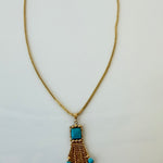Estate 14K yellow gold turquoise tassel pendant necklace shown full length on its gold bead chain