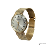 Vintage Girard-Perregaux 14K gold watch with diamond hour markers and mesh bracelet
