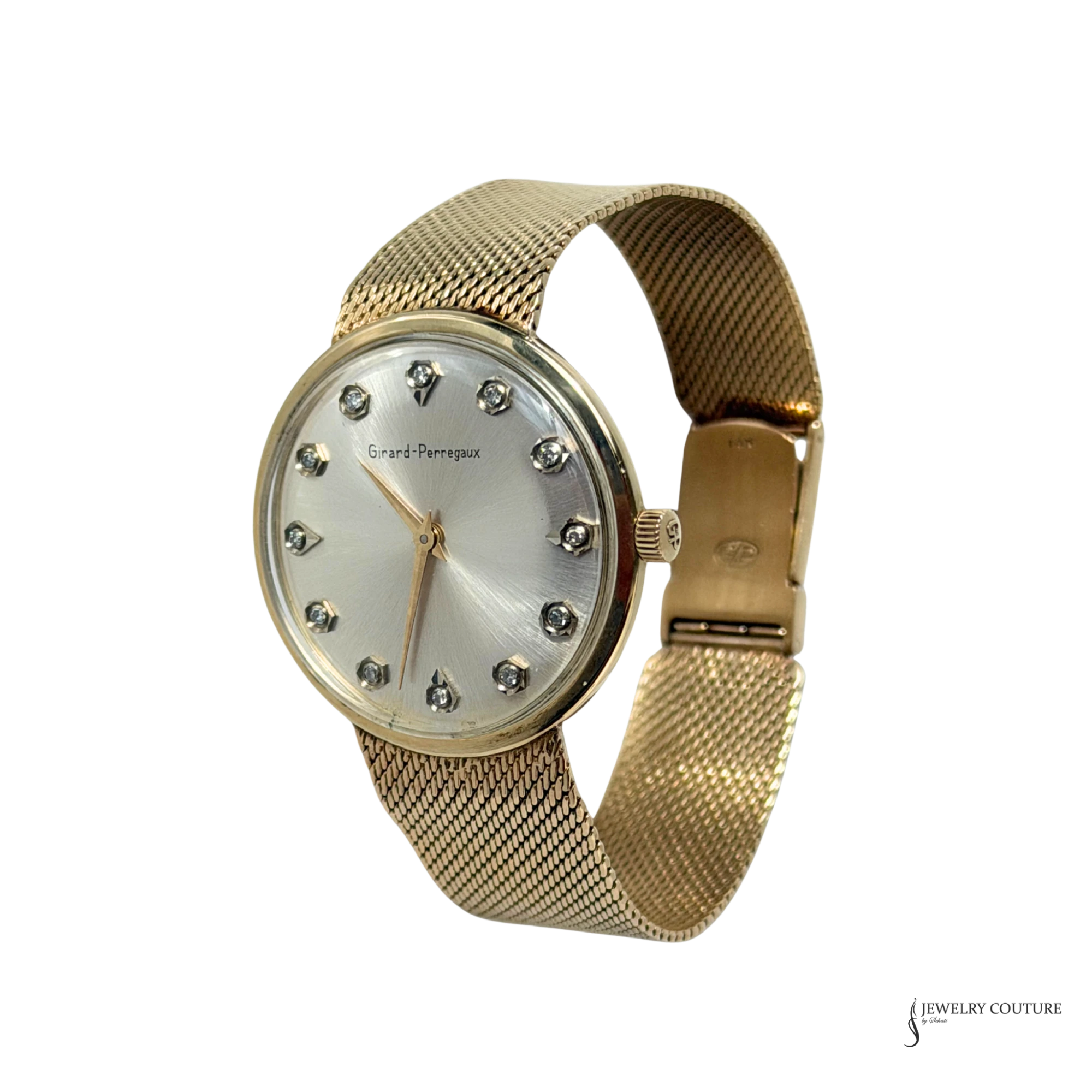 Vintage Girard-Perregaux 14K gold watch with diamond hour markers and mesh bracelet