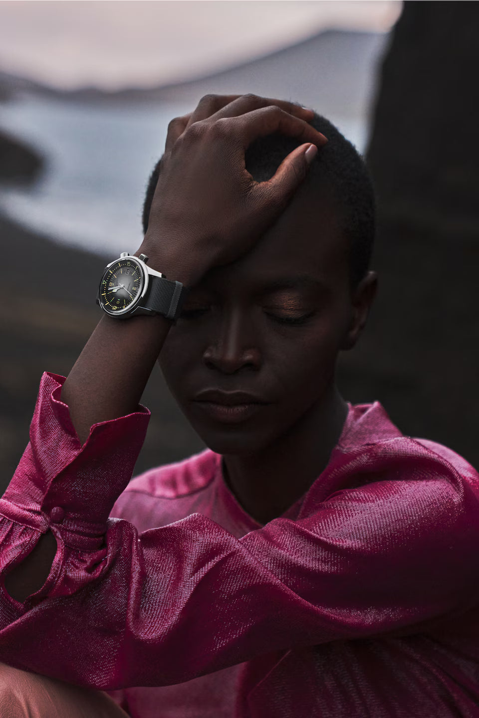 Person wearing a watch with a blurred background
