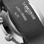 Close-up of a Longines watch strap with brand name and model number.