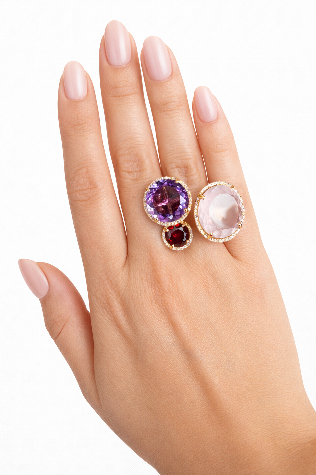 Hand wearing a ring with multicolored gemstones on a white background