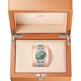 Omega watch in a wooden box on a white background