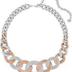 A two-tone chain link necklace featuring alternating silver and rose gold links, with textured silver pavé disc links and a silver extender chain on a plain white background.