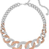A two-tone chain link necklace featuring alternating silver and rose gold links, with textured silver pavé disc links and a silver extender chain on a plain white background.