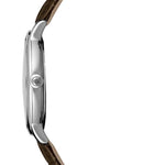 A side profile view of a wristwatch with a polished silver-tone case and a dark brown textured strap, shown against a plain white background.