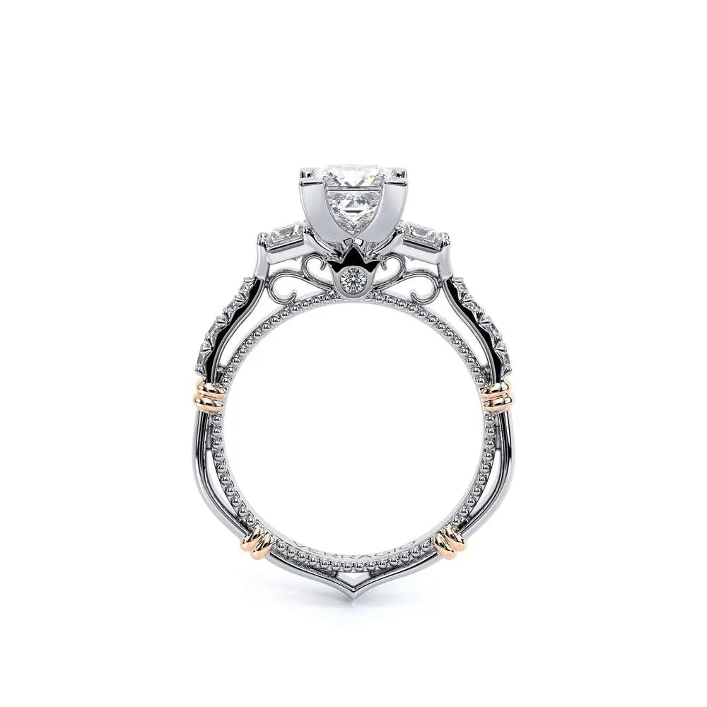 Elegant diamond ring with a white and rose gold band on a white background