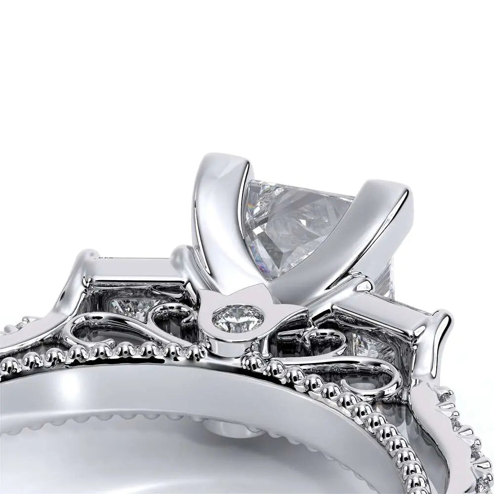 Close-up of a silver ring with a diamond on a white background