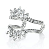 A silver-tone split-shank ring by Terrazzo, featuring marquise-cut and round-cut clear gemstones arranged in floral and leaf-like clusters, shown on a white background with a soft reflection.