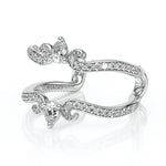 Silver ring with diamond accents on a white background