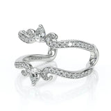 Silver ring with diamond accents on a white background