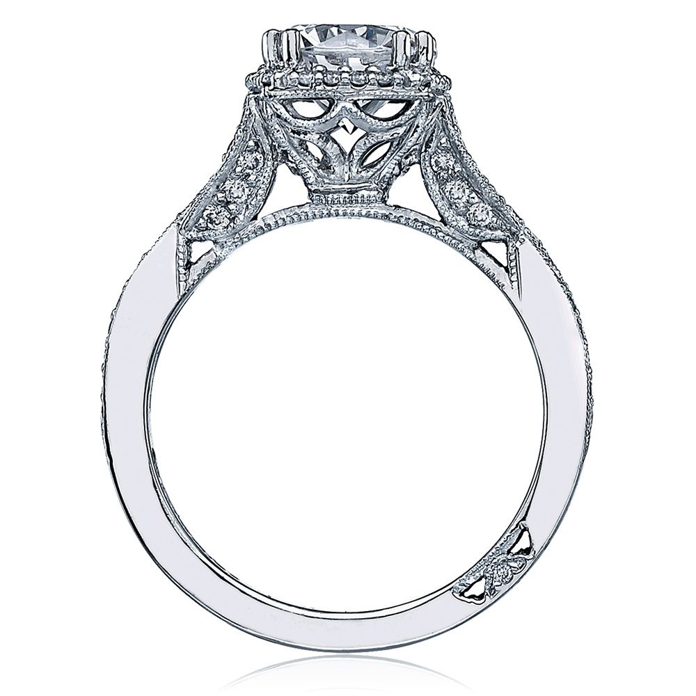 Elegant diamond ring with intricate design on a white background