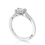 Diamond ring with 'Tacori' engraving on a white background