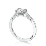Diamond ring with 'Tacori' engraving on a white background
